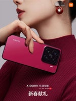 A woman is holding a Xiaomi 15 in red. 