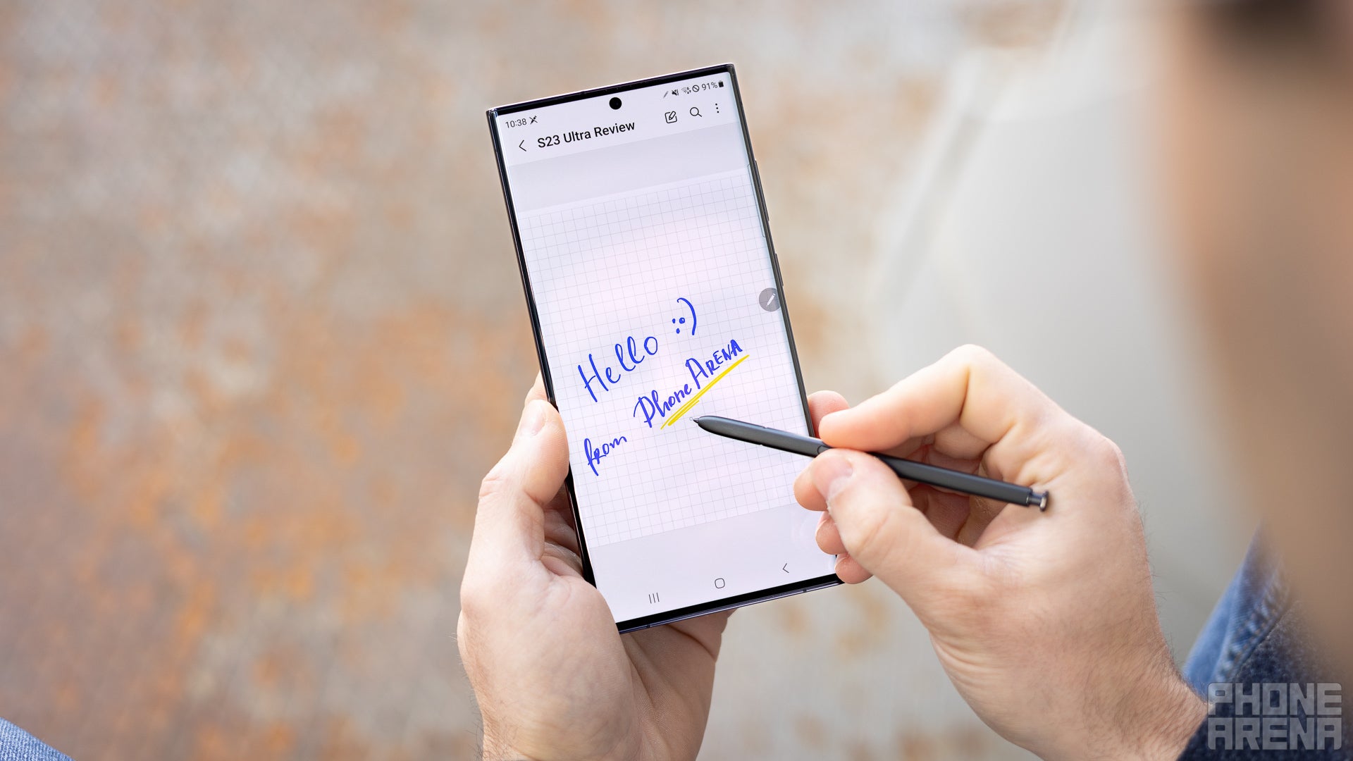 Samsung Galaxy S23 Ultra, screen is on and the Notes app is open. Person is writing on the screen with its S Pen