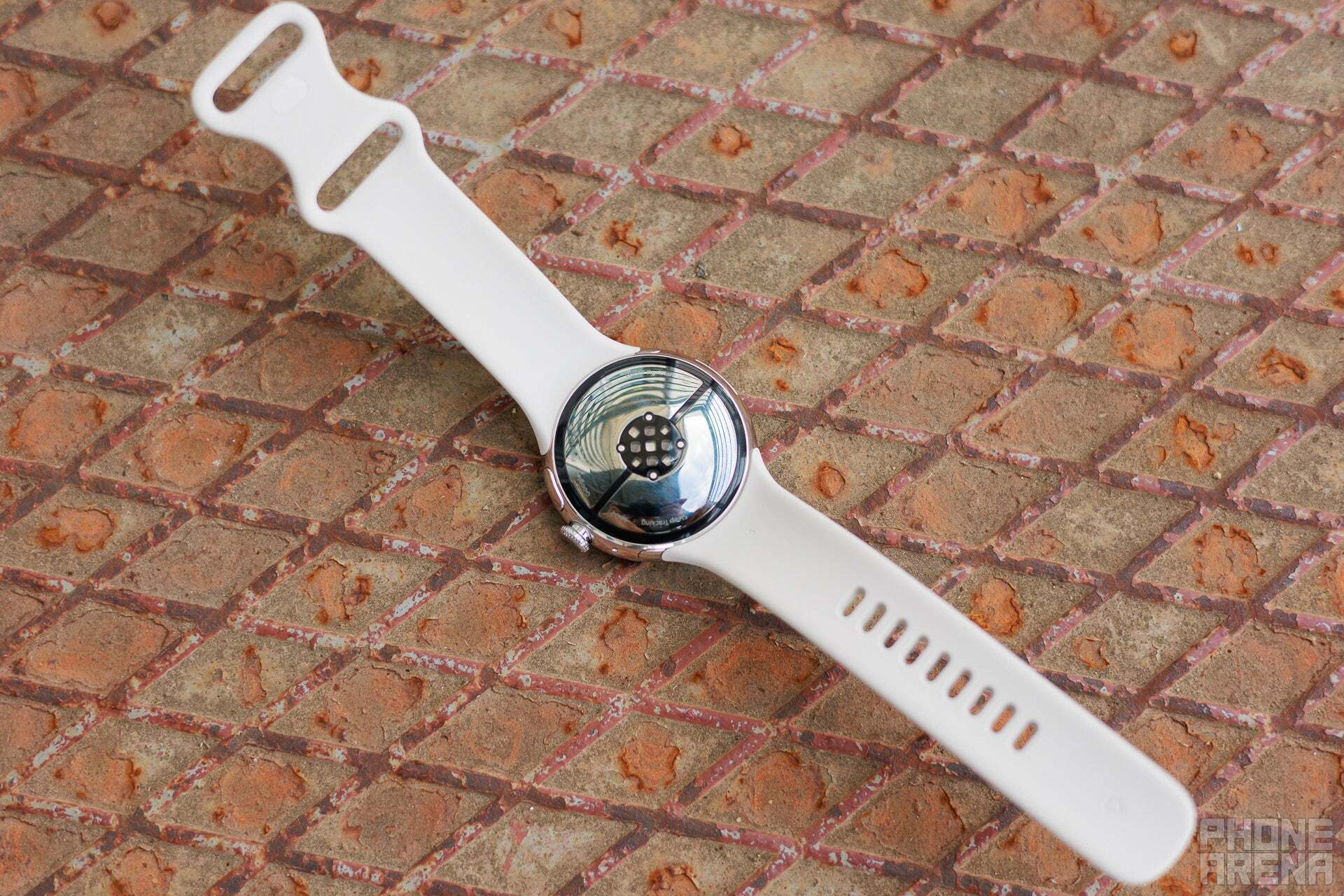 A top-down view of a white Google Pixel Watch 3. 