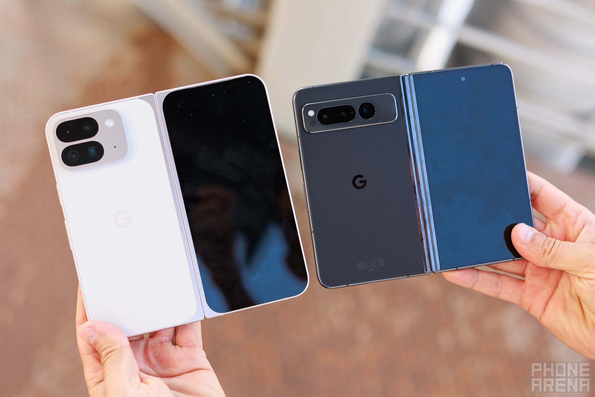 A person holding the Pixel 9 Pro Fold and the PIxel Fold. 