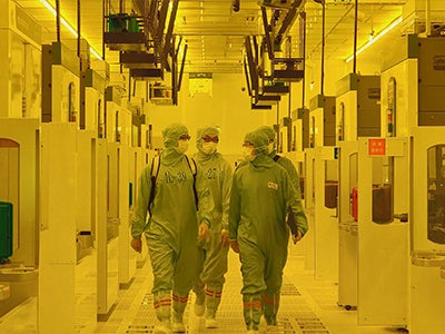 The inside of a TSMC fab which uses yellow light  to keep certain wavelengths of light from interfering with lithography. | Image credit-TSMC - TSMC is the "most powerful company in the world" says the most powerful man