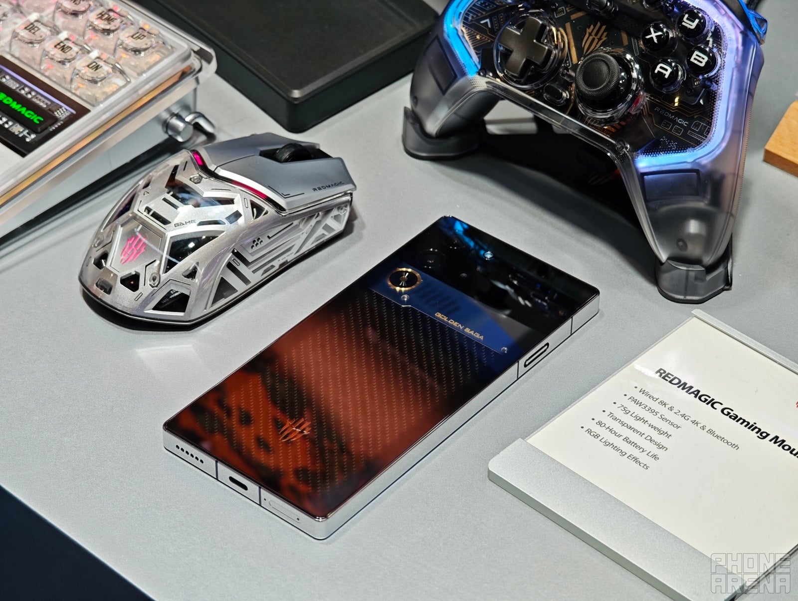 Despite the classy looks, the RedMagic 10 Pro Golden Saga fits perfectly with other gaming paraphernalia (Image by PhoneArena) - RedMagic 10 Pro Golden Saga hands-on: A premium gaming phone unlike any other