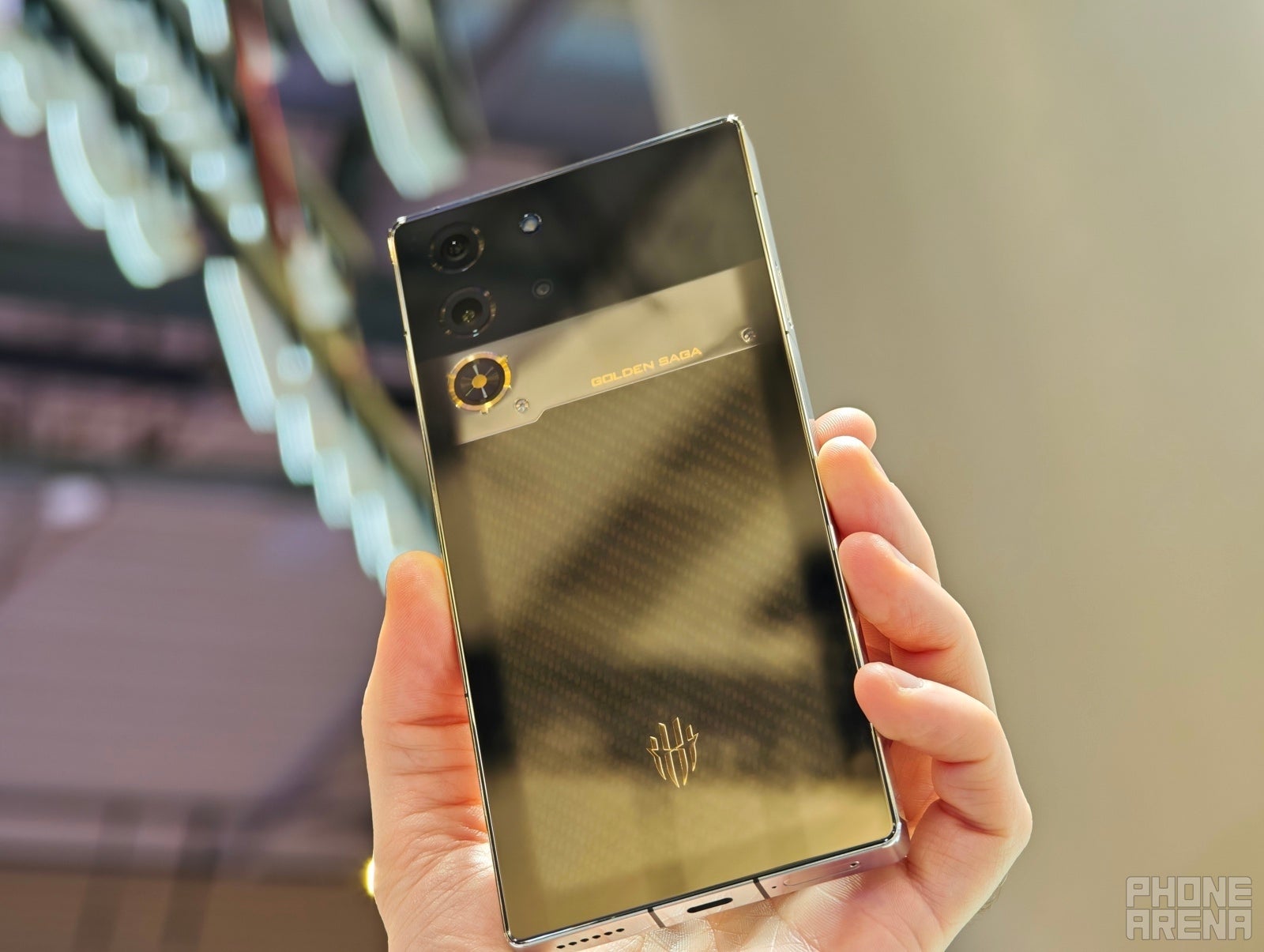 The mirror-like finish is stunning in real life (Image by PhoneArena) - RedMagic 10 Pro Golden Saga hands-on: A premium gaming phone unlike any other