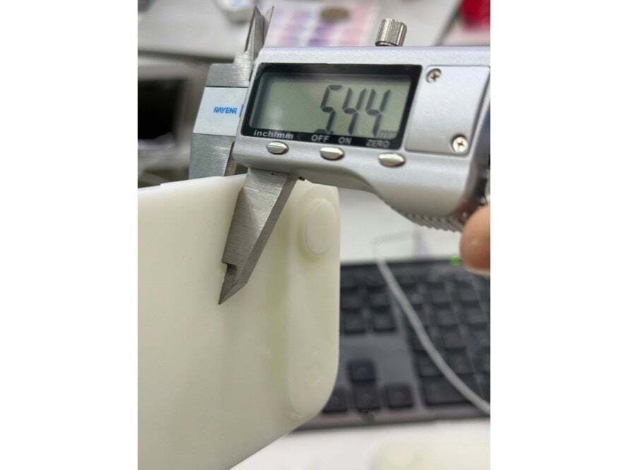 Image of an iPhone 17 Air dummy unit being measured