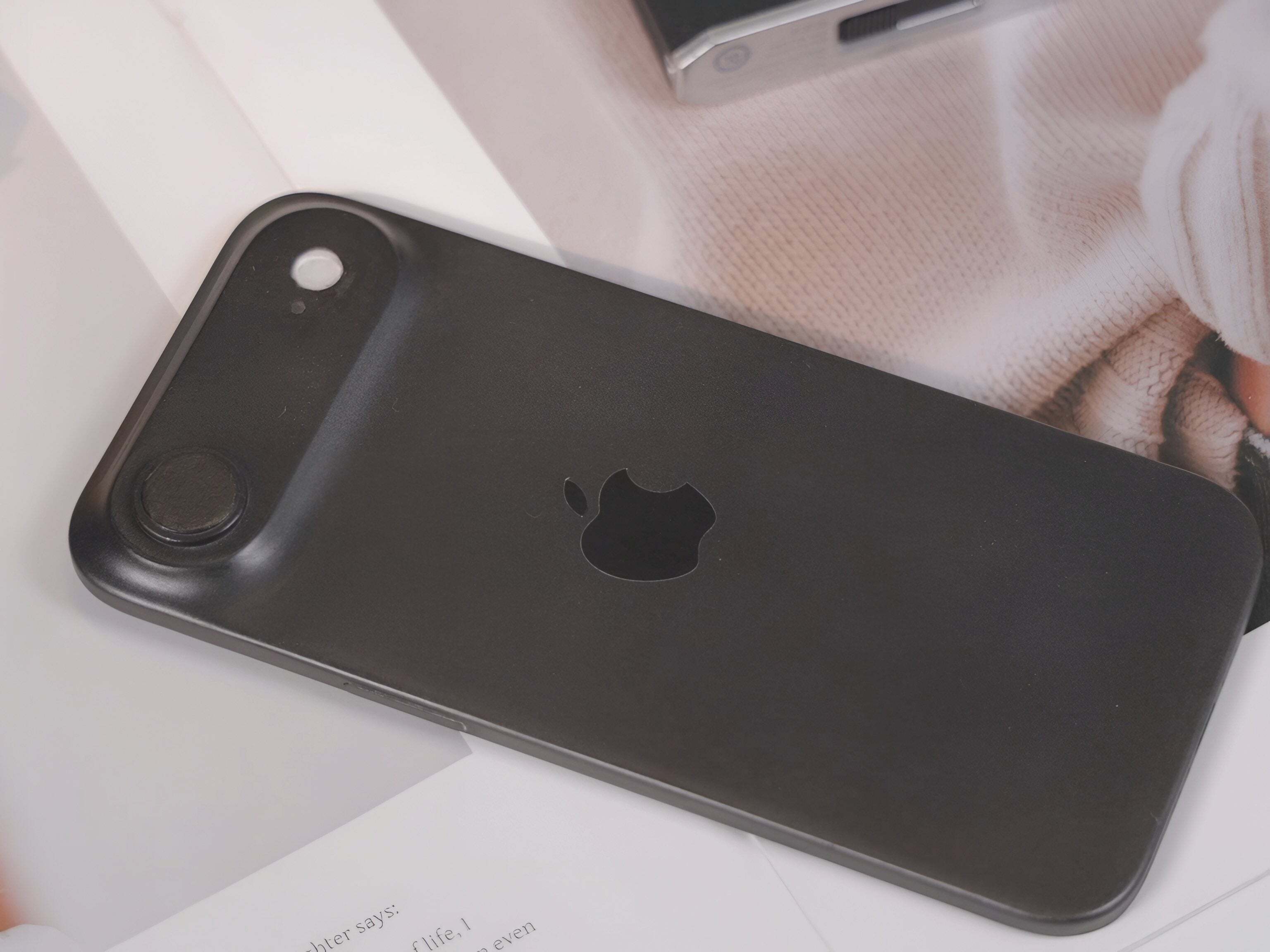 Image featuring a iPhone 17 Air lying on a light-colored surface.