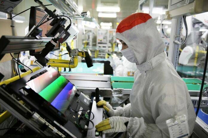 Image of a worker at a Samsung display factory in India