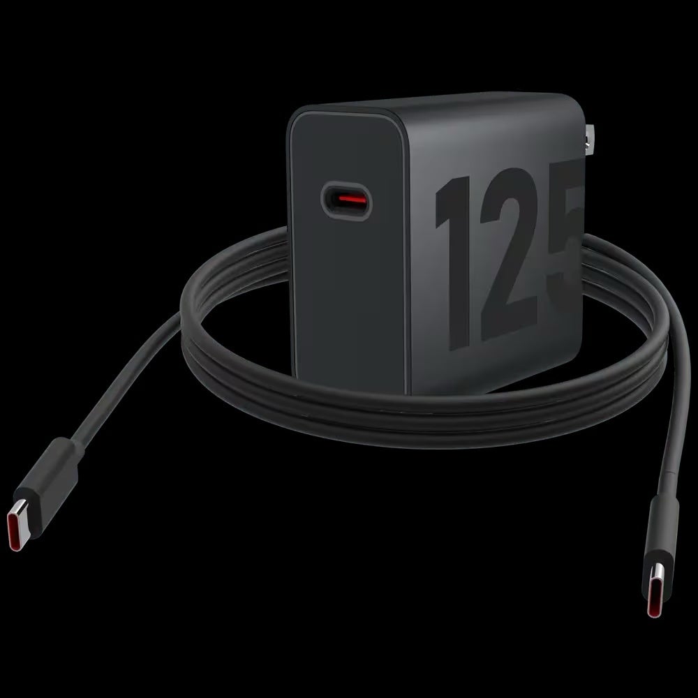 A black Motorola TurboPower GaN charger with &amp;quot;125W&amp;quot; printed on the side is shown with its attached USB-C to USB-C cable.