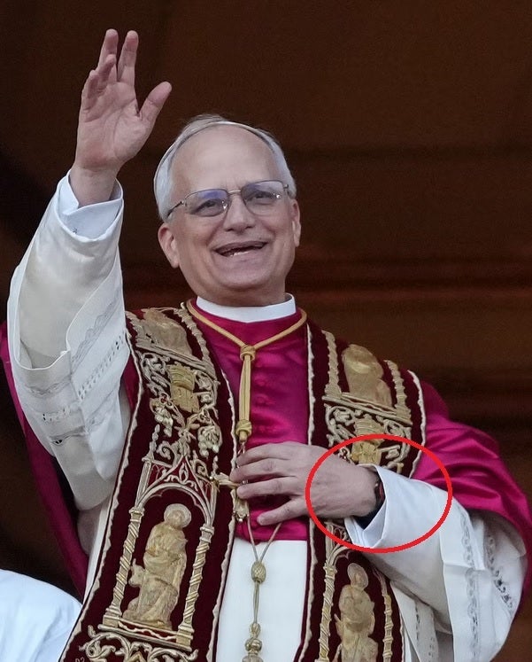 Mystery watch with red bezel peeks out from the Pope's left sleeve. | Image credit-Esquire - The first American Pope could be the first to embrace wireless tech as he sports an Apple Watch