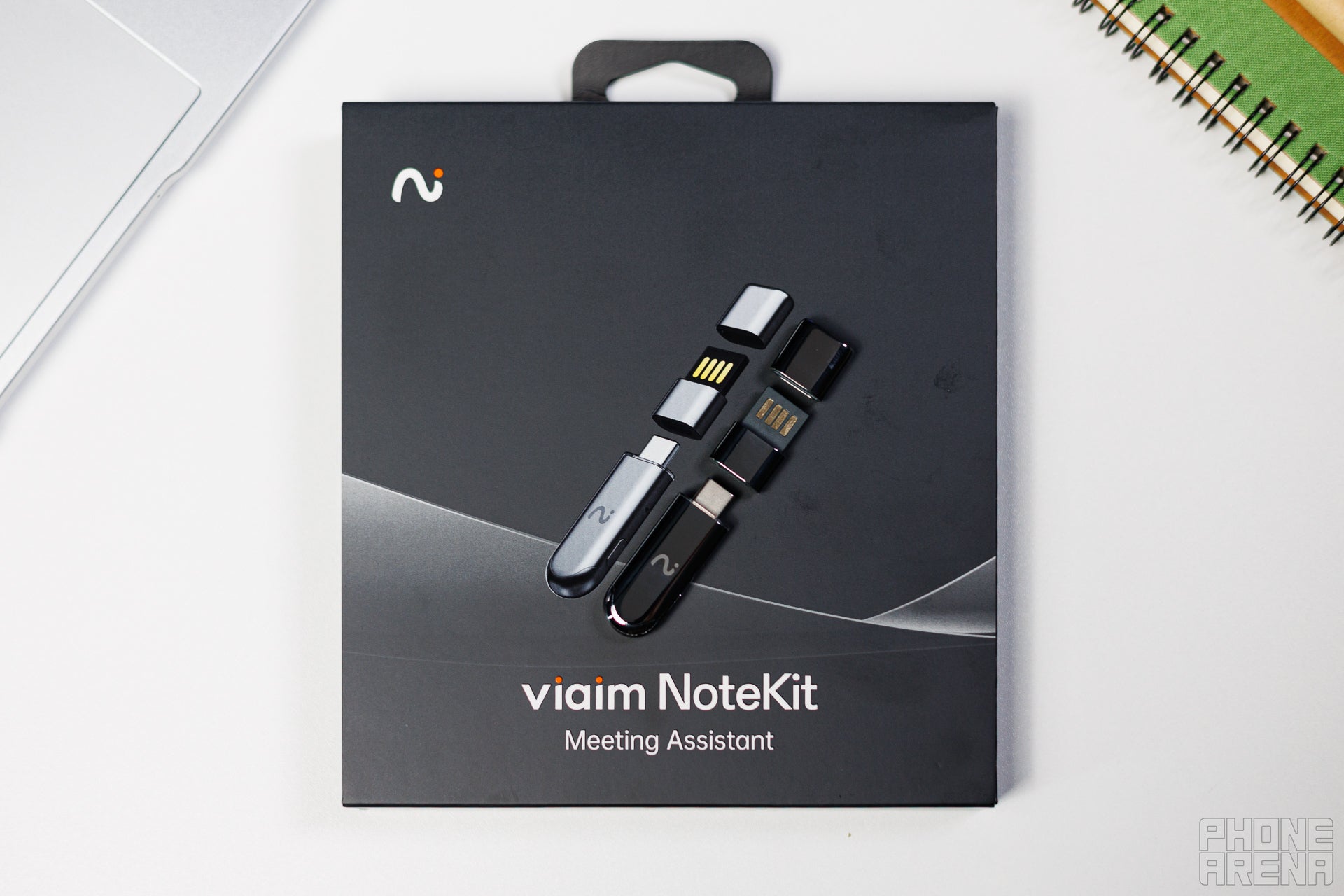 Viaim NoteKit laid on top of its box, clearly showing its protective cap and USB B to USB C adapter that are included