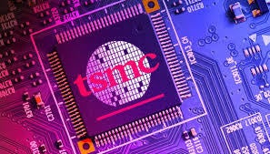 The iconic TSMC silicon wafer logo is shown on a chip.