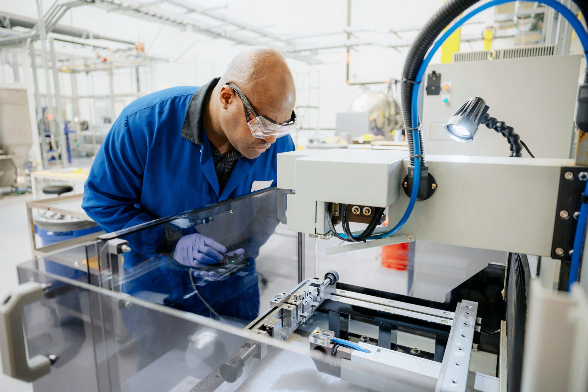  A photo showing a worker inside a factory. 