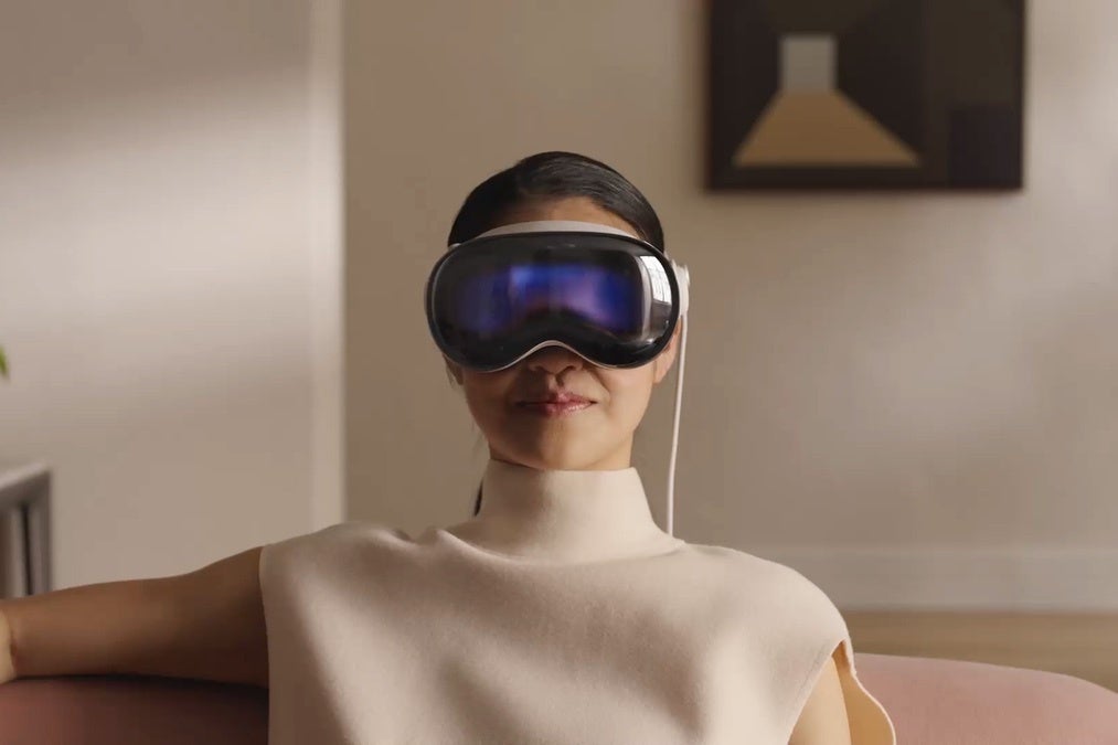 A woman wearing an Apple Vision Pro