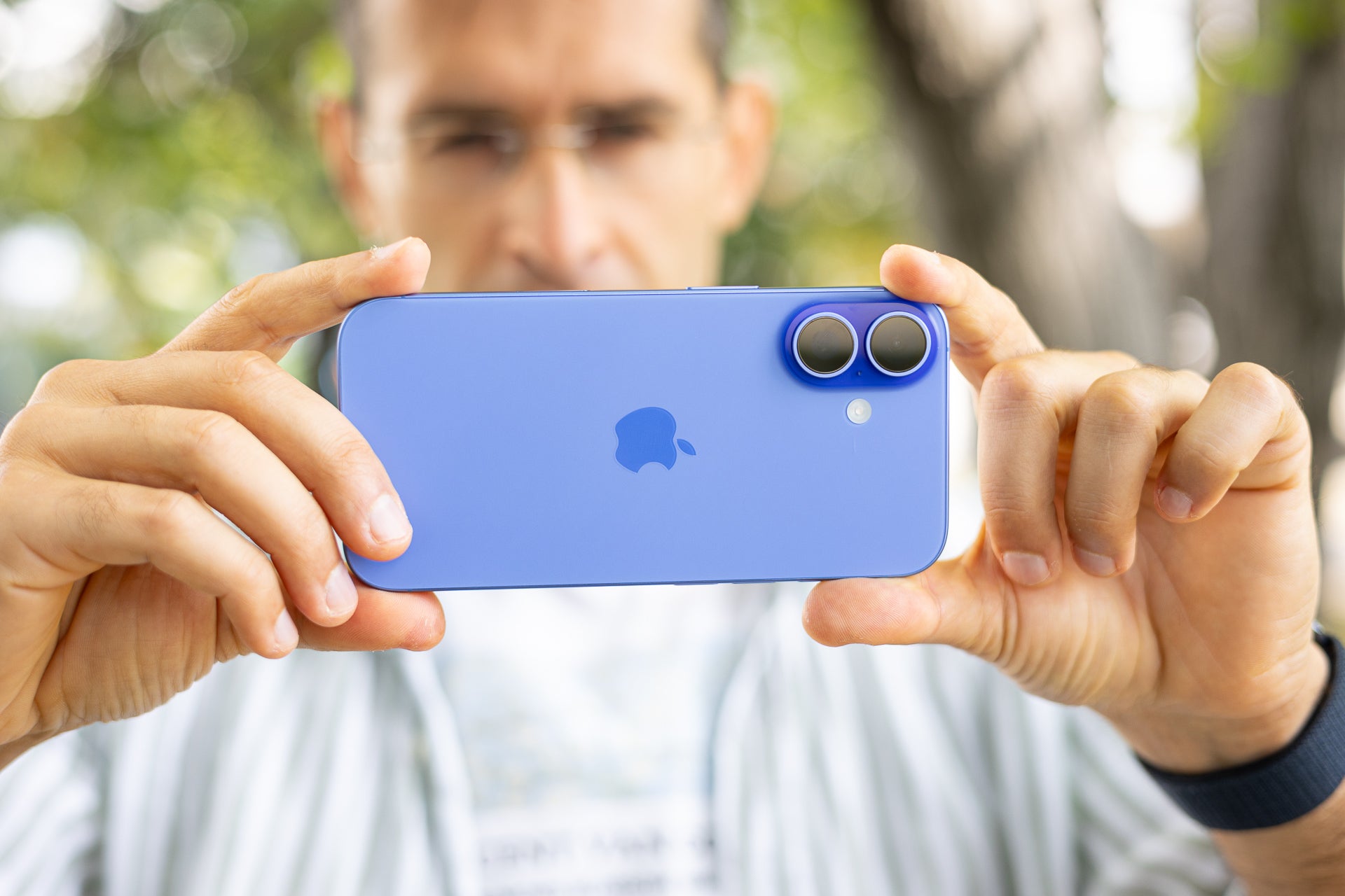 A man shooting with the iPhone 16.