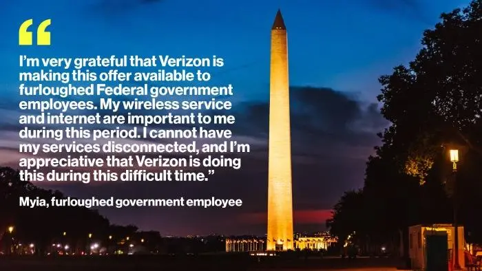 A nighttime photo of the Washington Monument in Washington D.C., glowing yellow and orange against a deep blue sky.