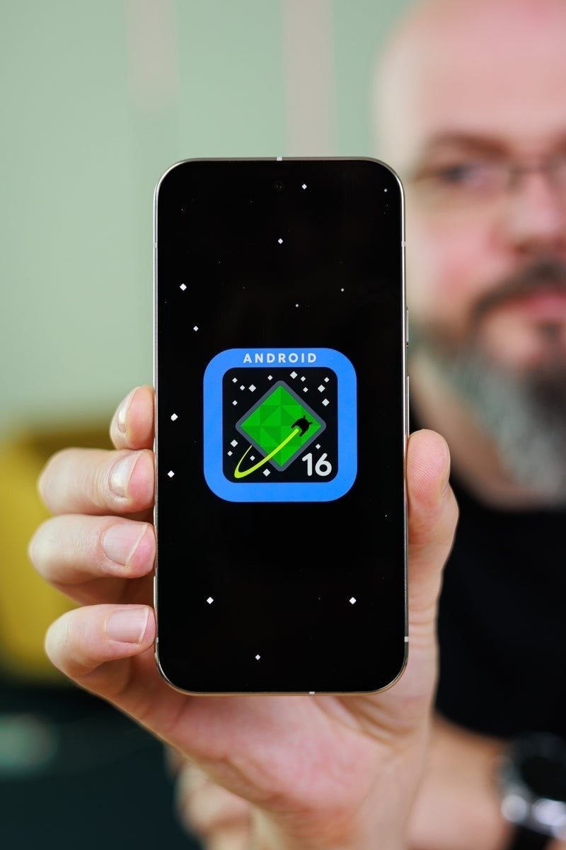 Pixel 10 Pro displaying the Android 16 logo on its screen during startup.