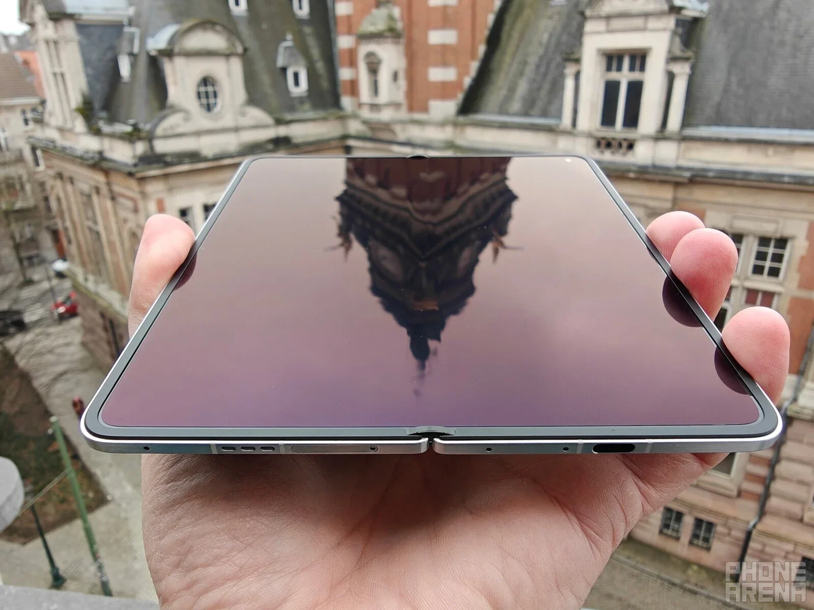 Oppo foldable phone held in hand.