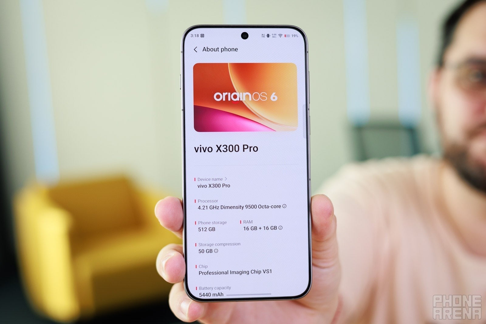 Person holding a Vivo X300 Pro showing device specs with the Dimensity 9500 chip listed.