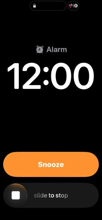 Screenshot of nostalgic slider that dismisses alarms and timers on iOS 26.1.