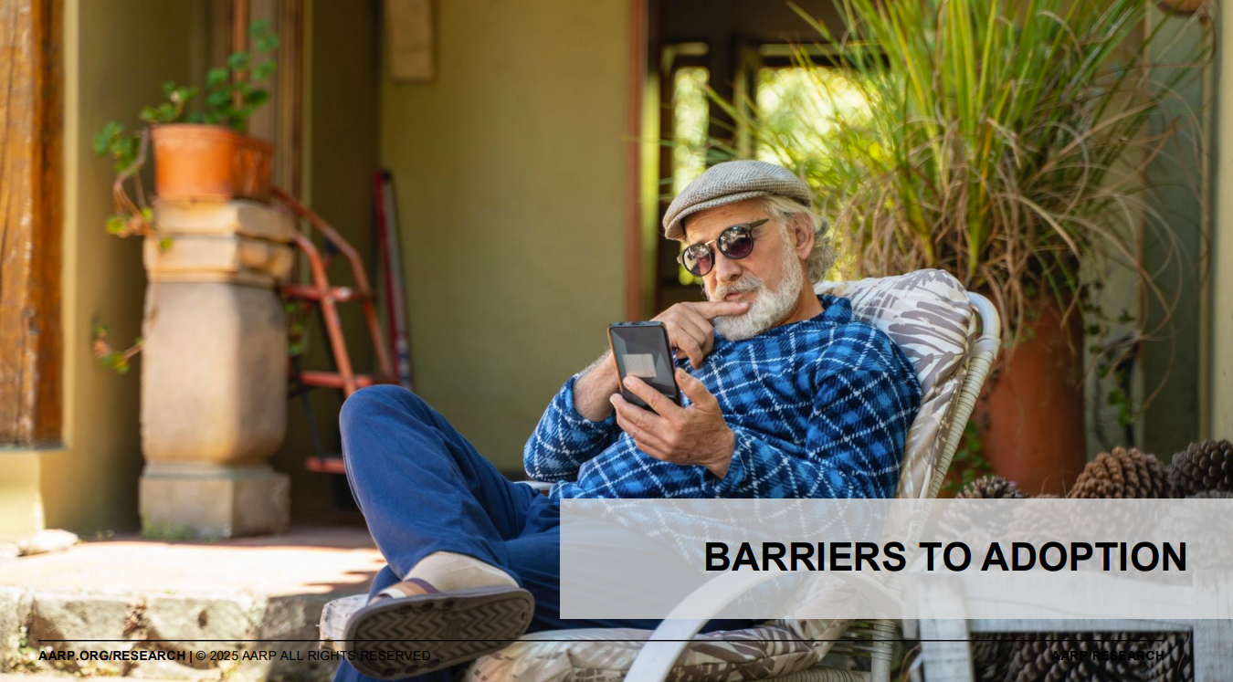 A senior man holding a smartphone.
