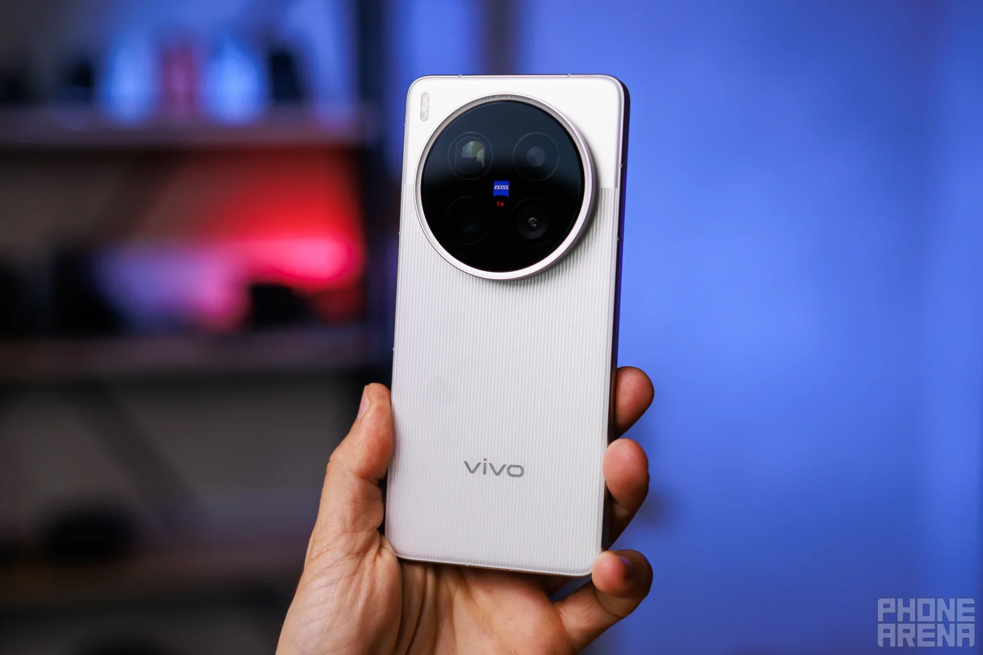 Vivo phone held in hand, close-up.