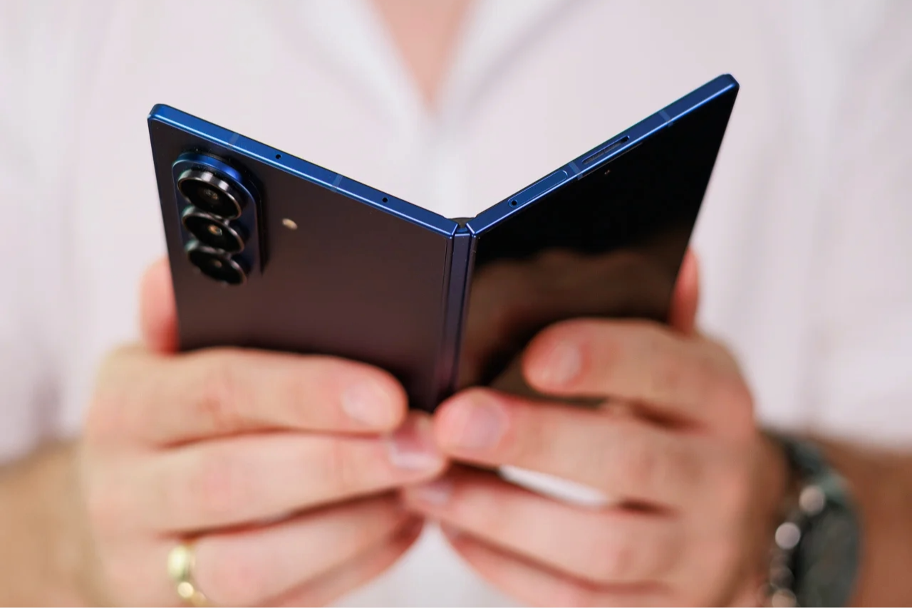 A photo of a person holding the Galaxy Z Fold 7 in their hands. 