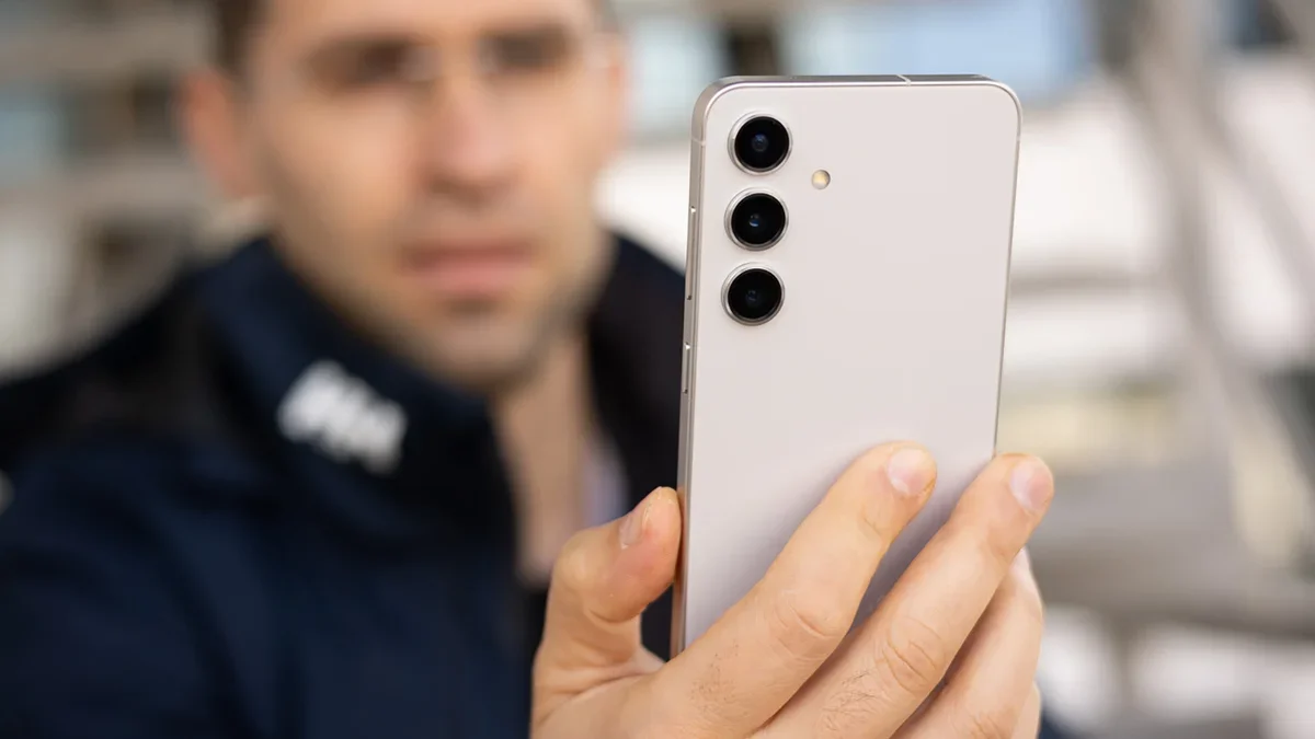 A man holding a Galaxy phone.