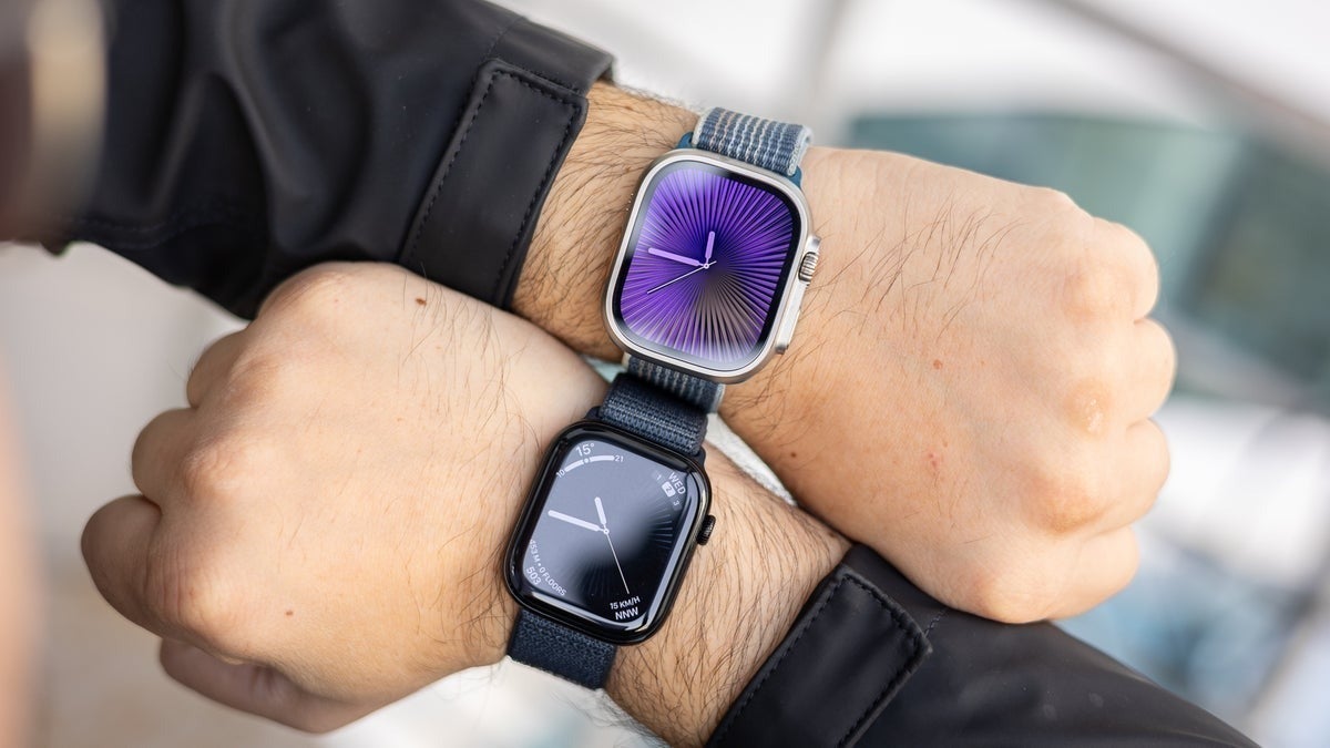 Two Apple Watches on wrists side by side