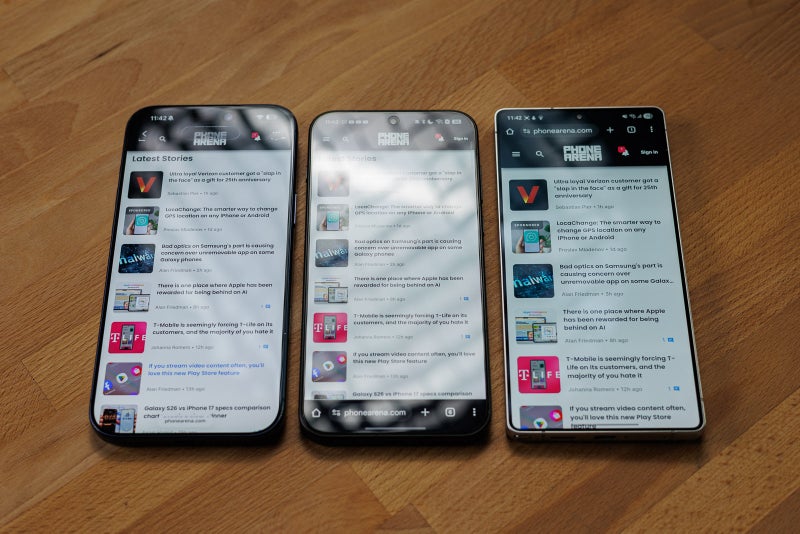 Three phones with high brightness displays and noticeable screen reflections on some..