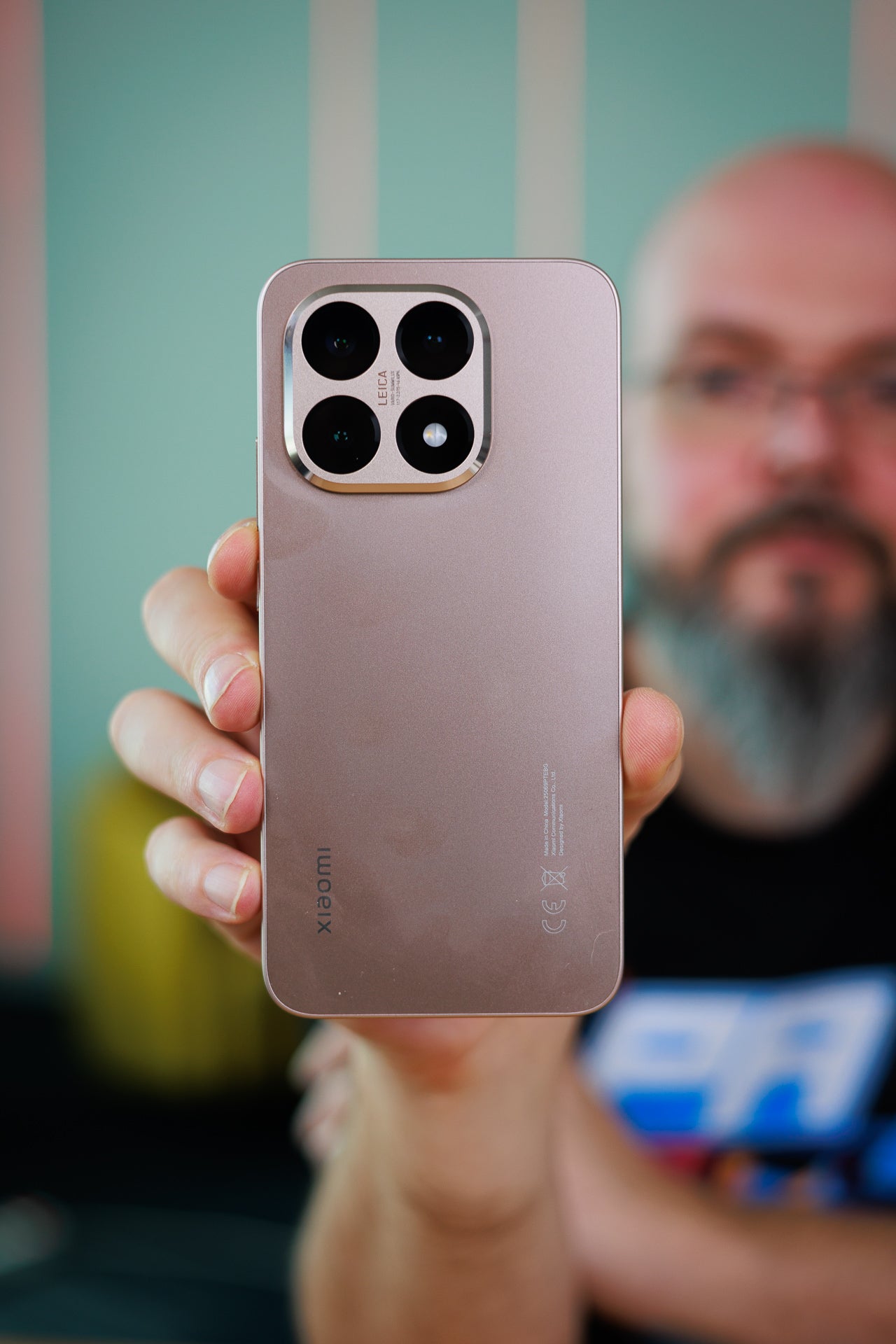 A man holding the Xiaomi 15T.