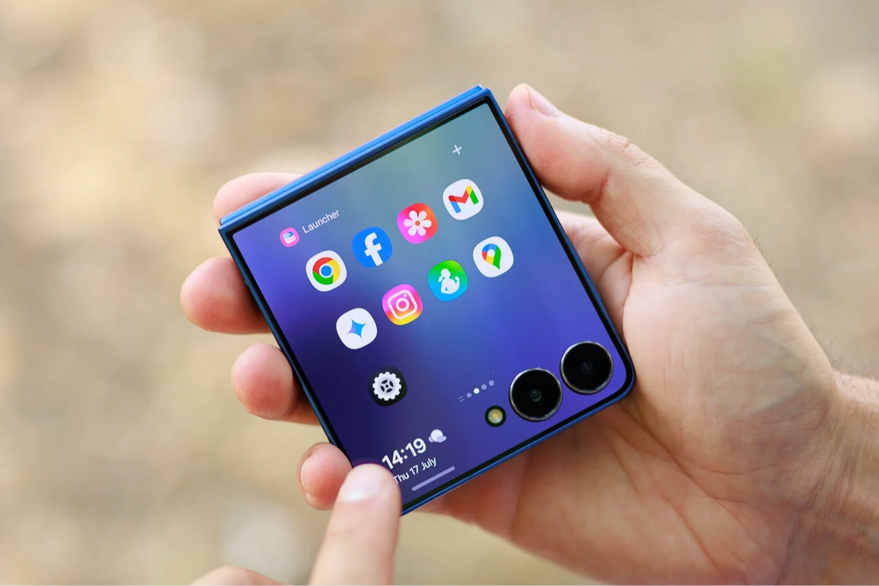 A photo of the Galaxy Z Flip 7, being held in a hand.