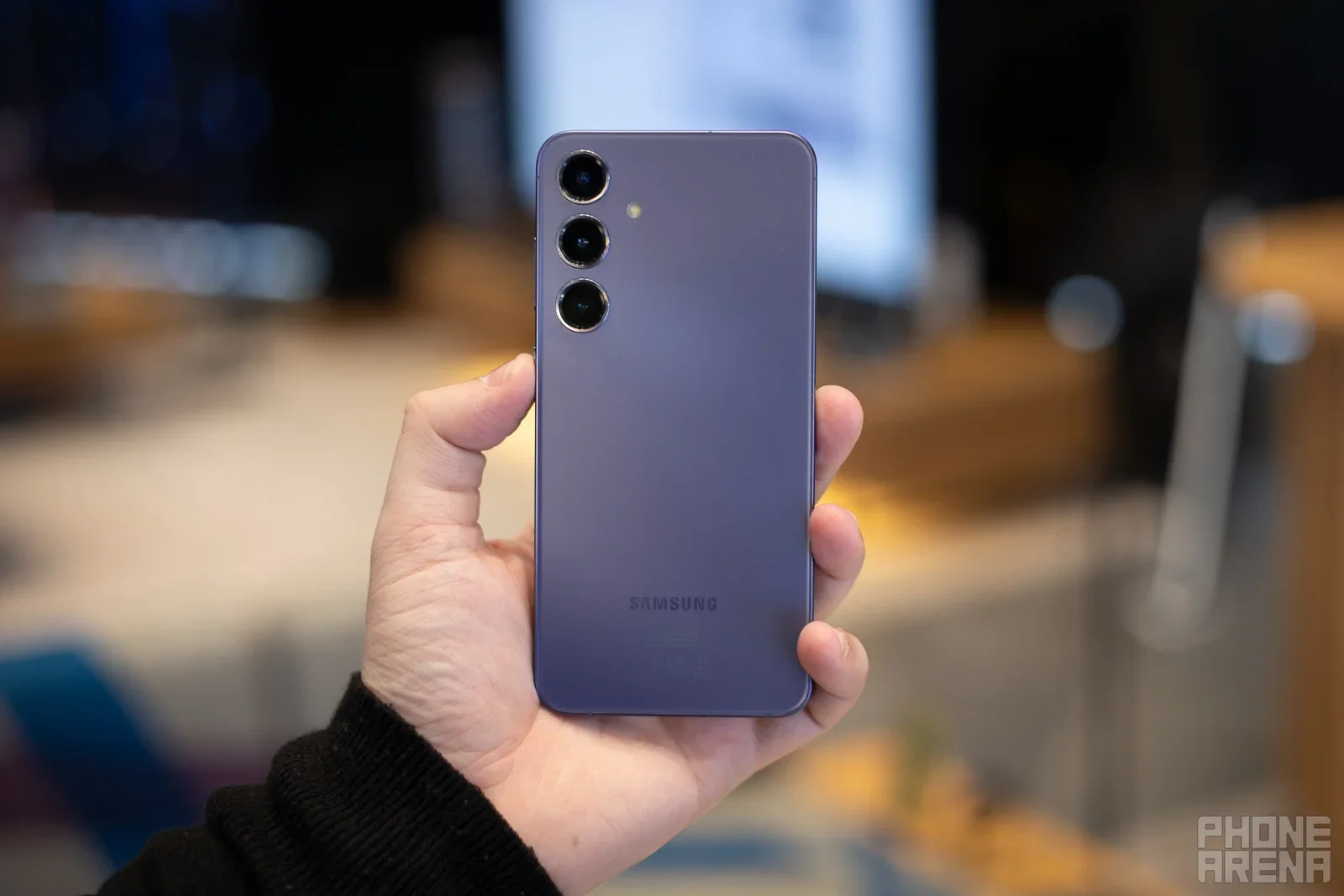 A Galaxy phone held in hand.