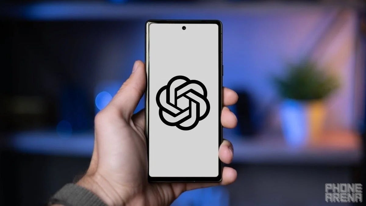 A man holding a smartphone that has the ChatGPT logo on its screen.