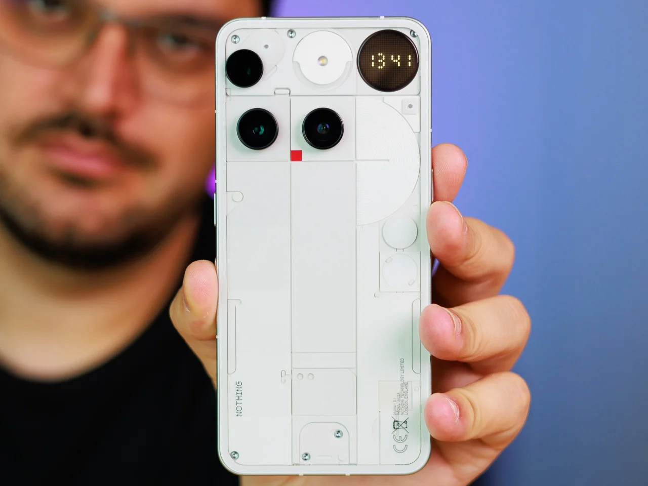 A photo of a person holding the Phone (3).