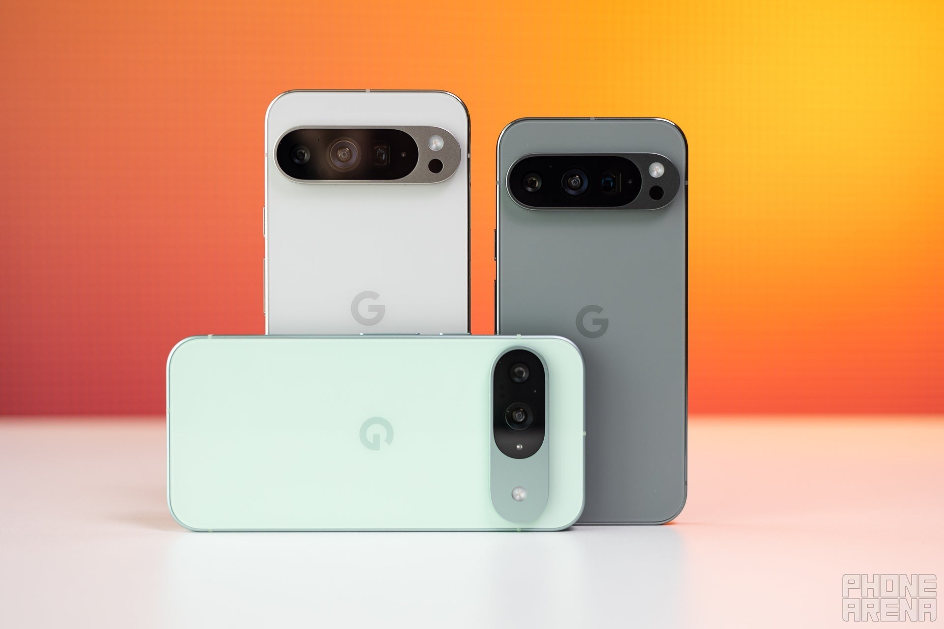 Three Google Pixel phones arranged upright, showing their rear cameras.