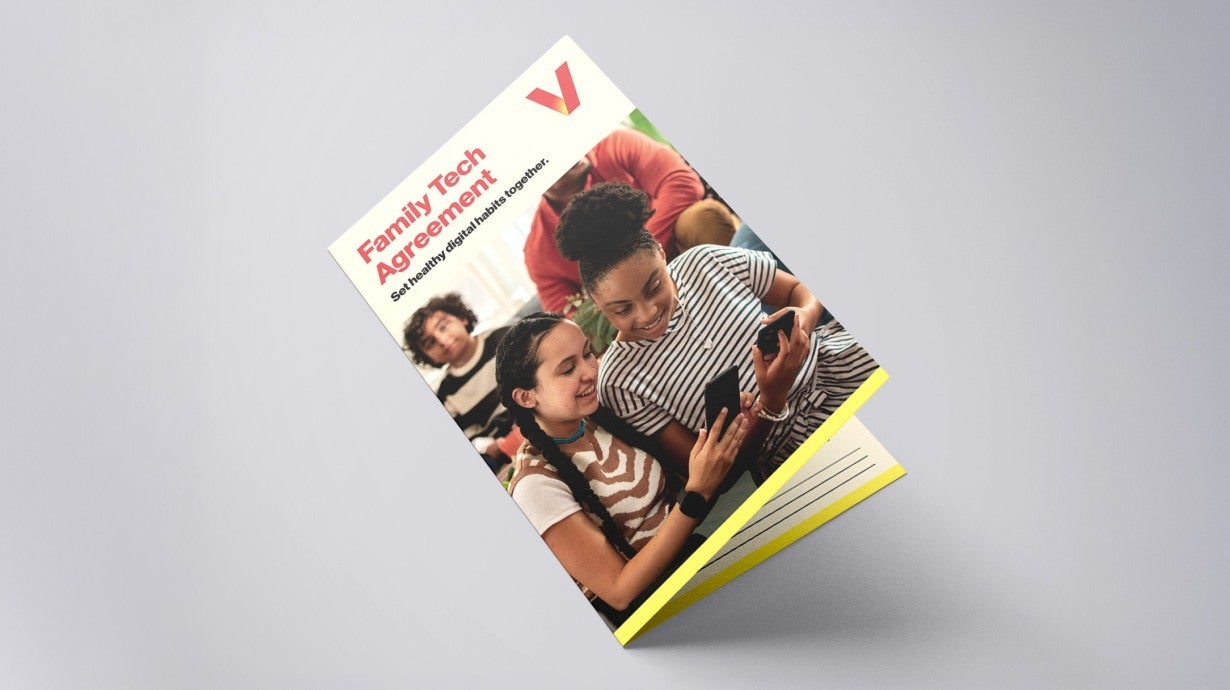 A yellow and white booklet, titled Family Tech Agreement.