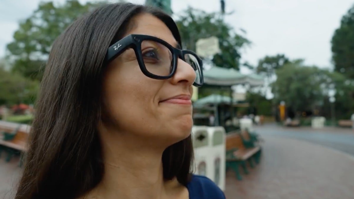 Person wearing Ray-Ban smart glasses while outdoors.