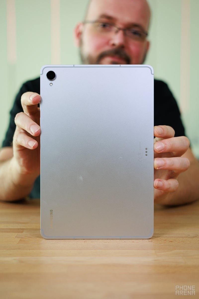 Back of a Samsung tablet held by reviewer