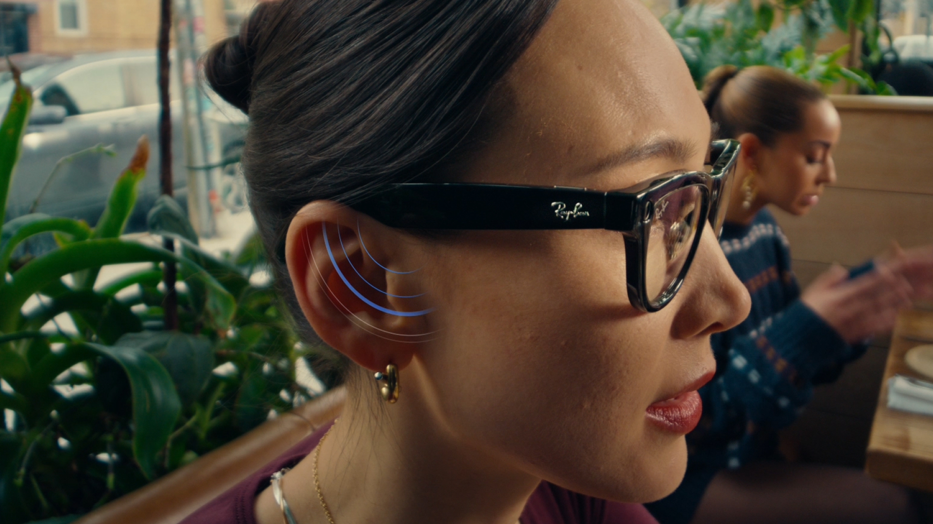 A woman wearing Meta Ray-Ban AI glasses.