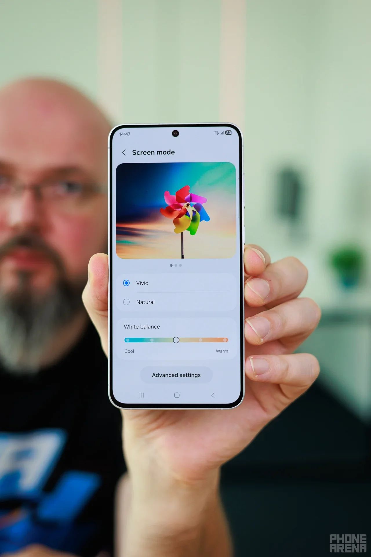 Galaxy phone held in hand.