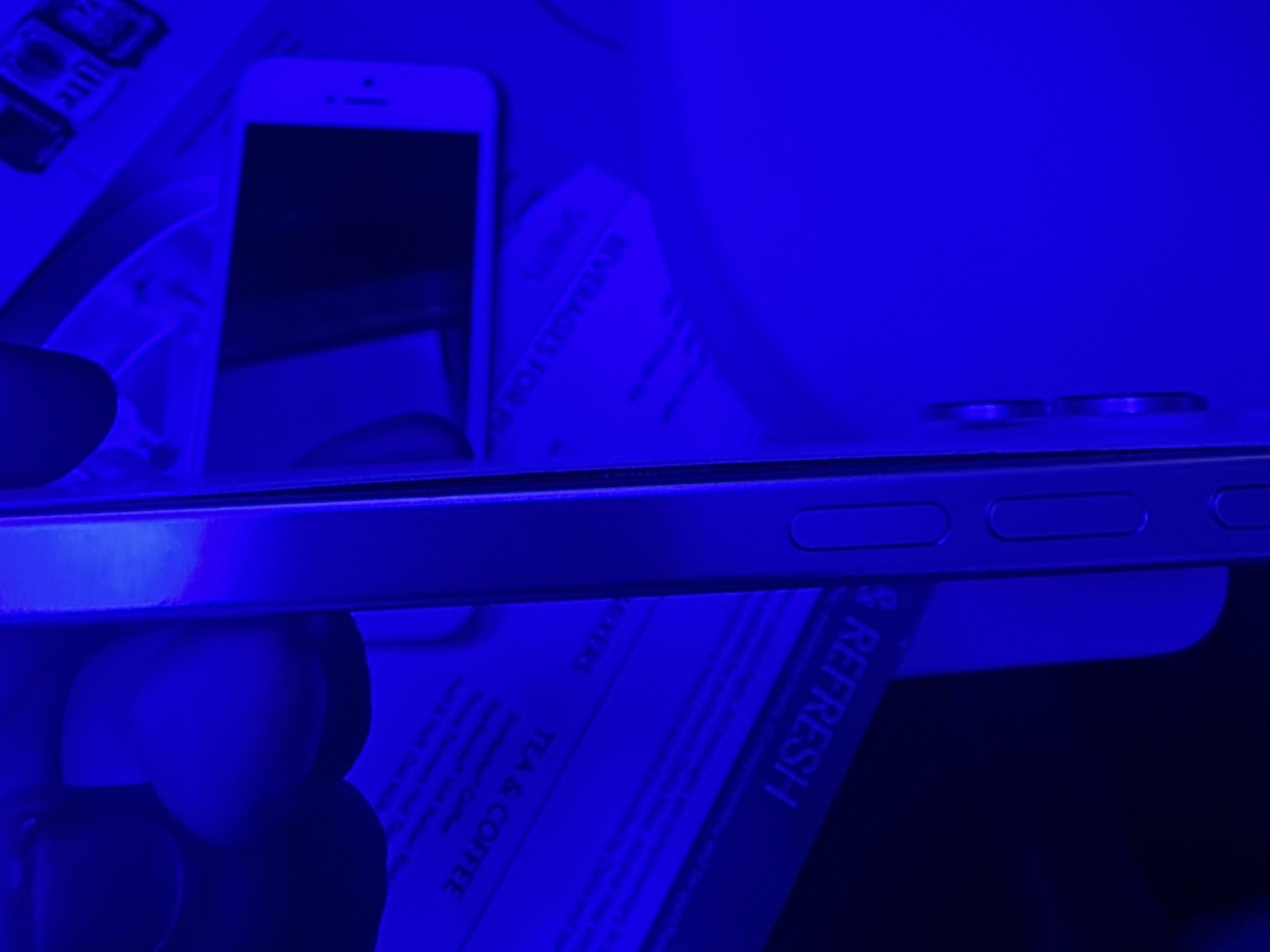 Swollen iPhone 16 Pro Max on a flight