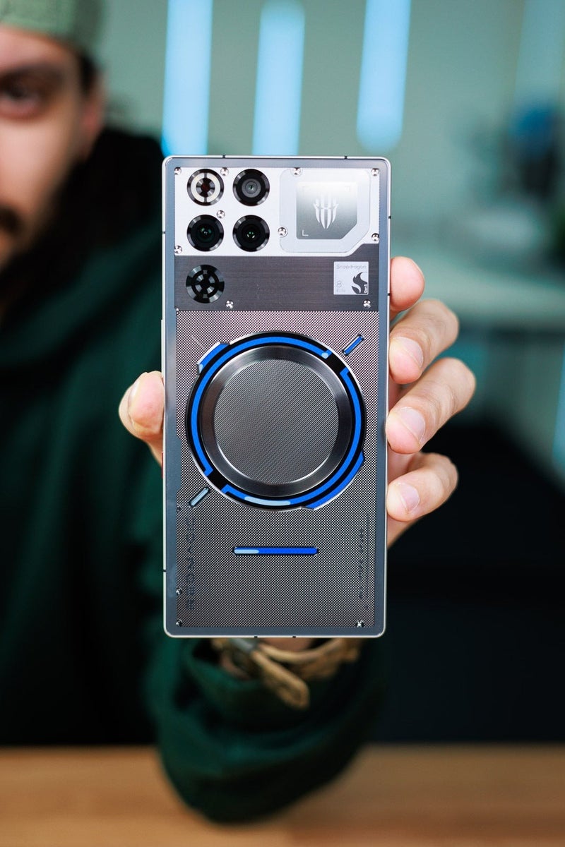 Close-up of a gaming phone back with large circular camera module and industrial design details.