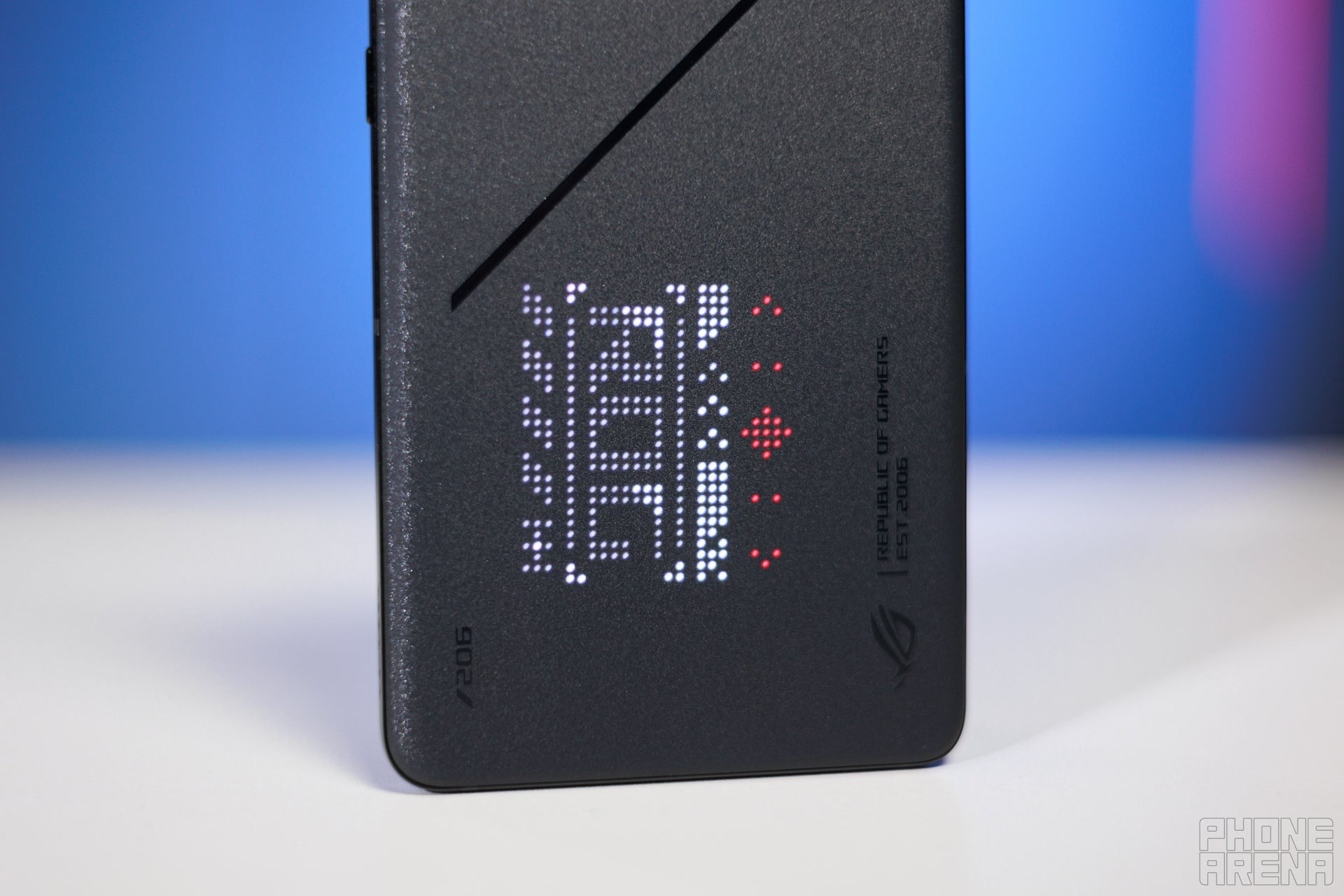 Gaming phone back with LED dot-matrix display lit up, showing customizable lighting.
