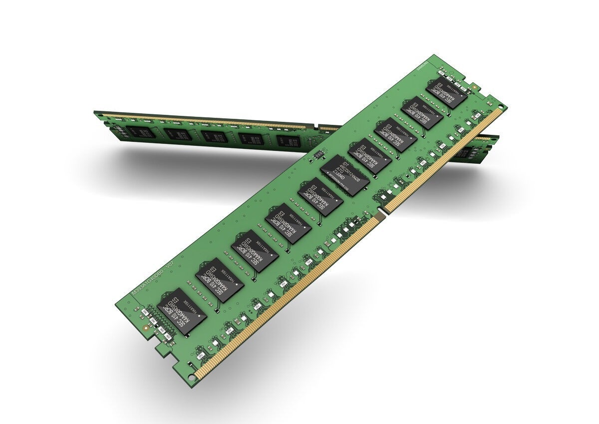 Two green DDR memory sticks with exposed black memory chips on a white background.