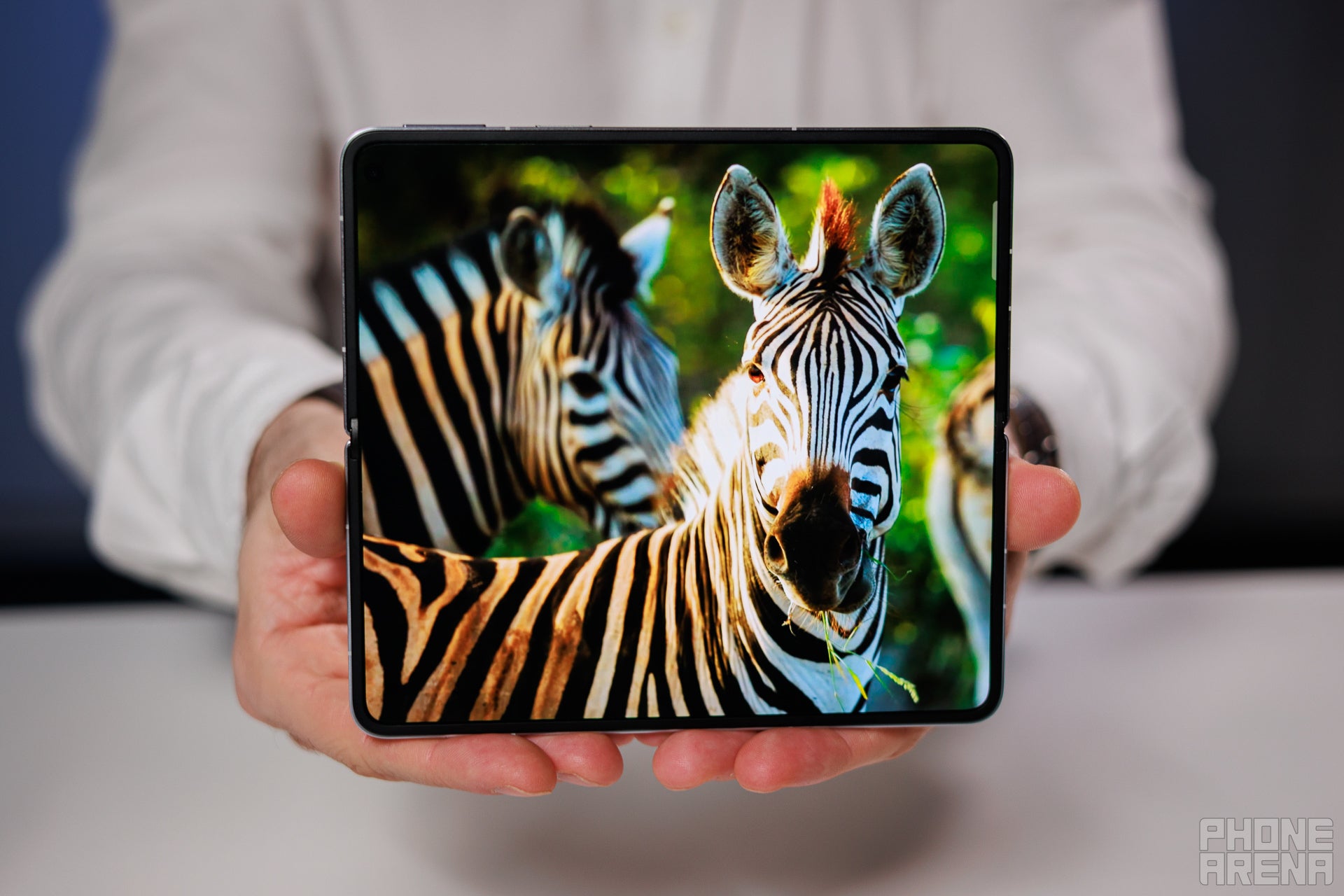 A man holding the Oppo Find N5.