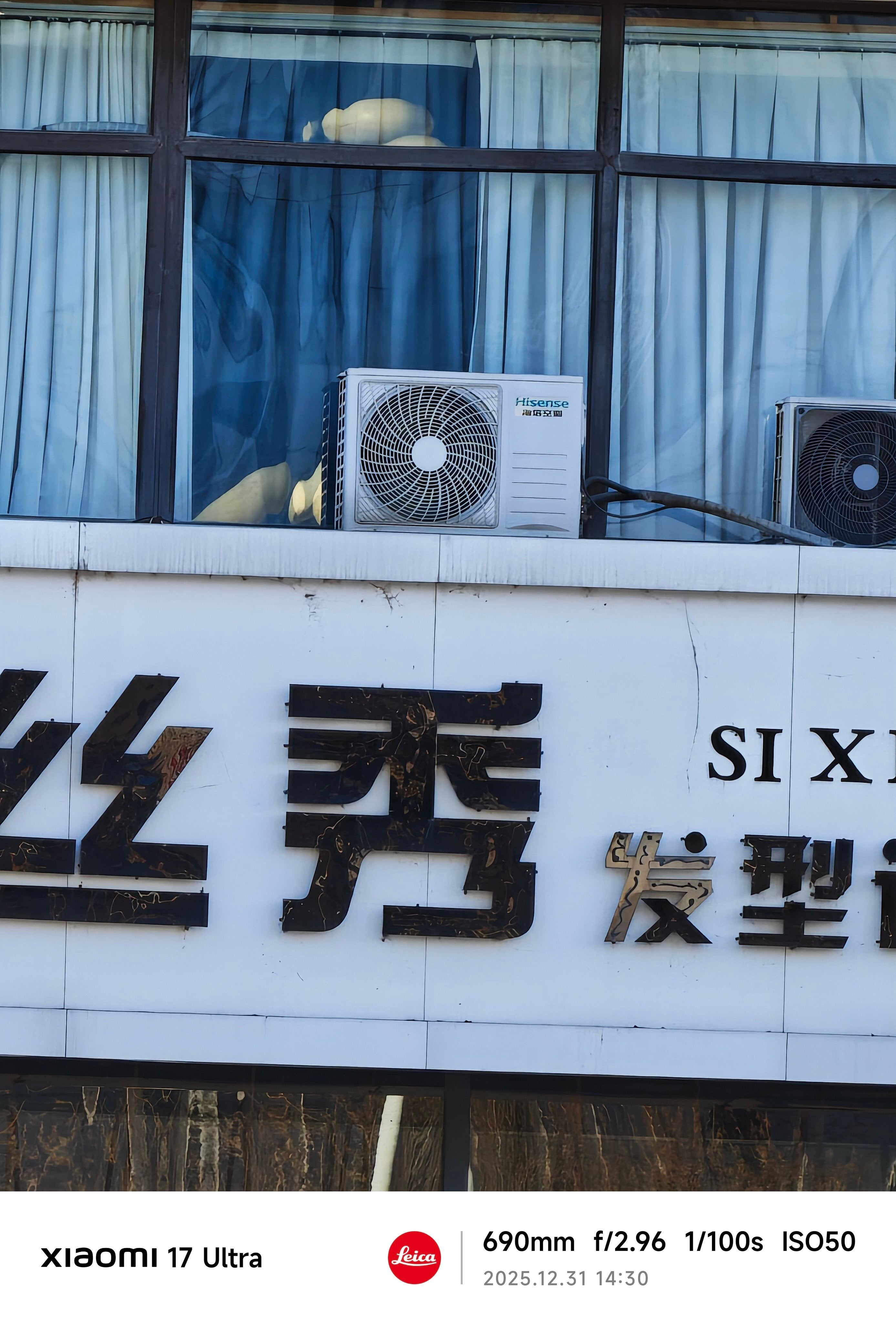 A photo of a air conditioner on a building.