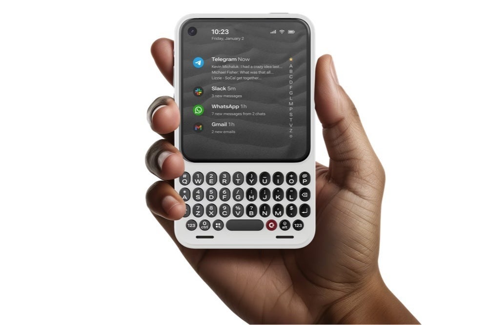 Hand holding the Clicks Communicator smartphone