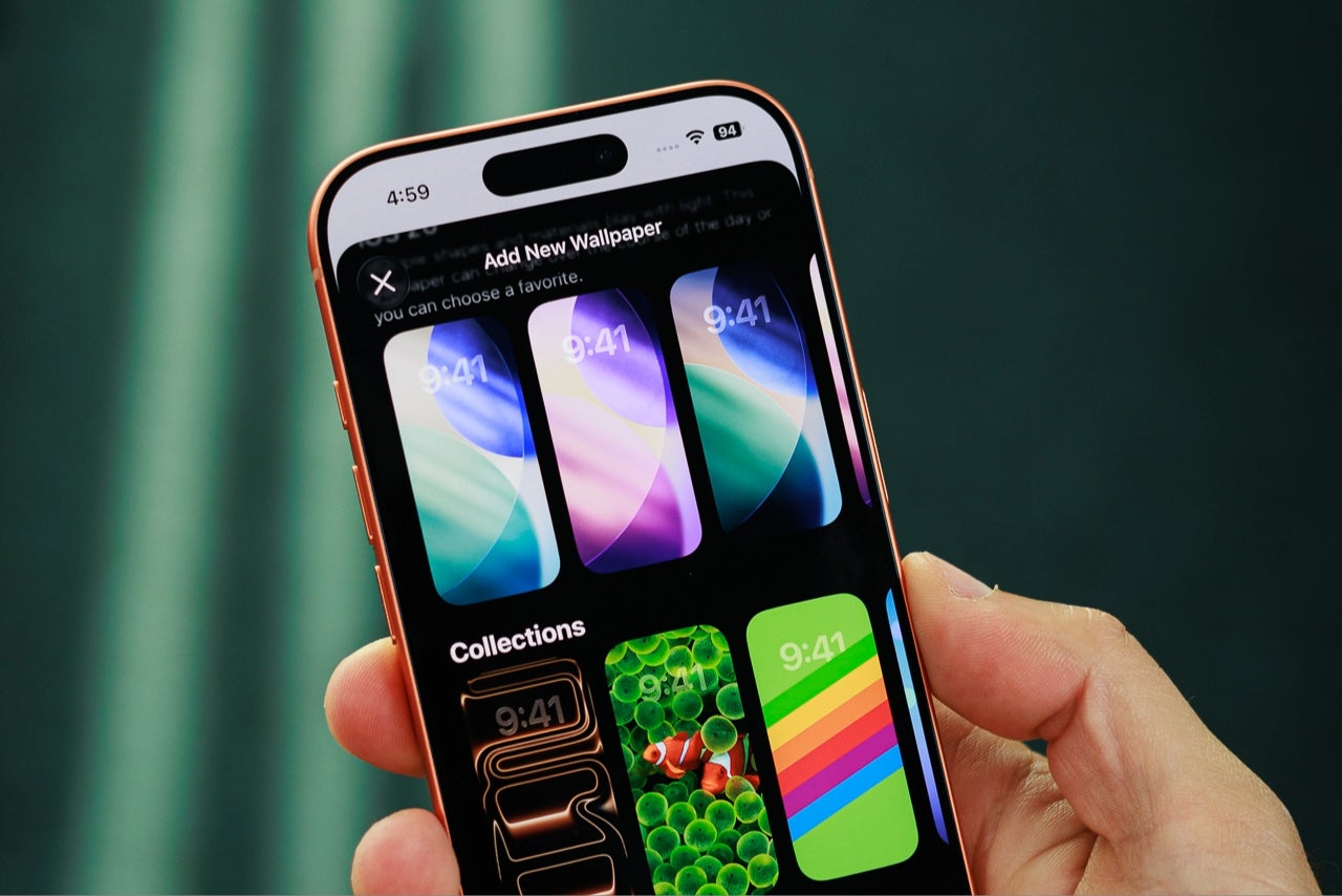 A hand holding the iPhone 17 Pro with its display front and center.