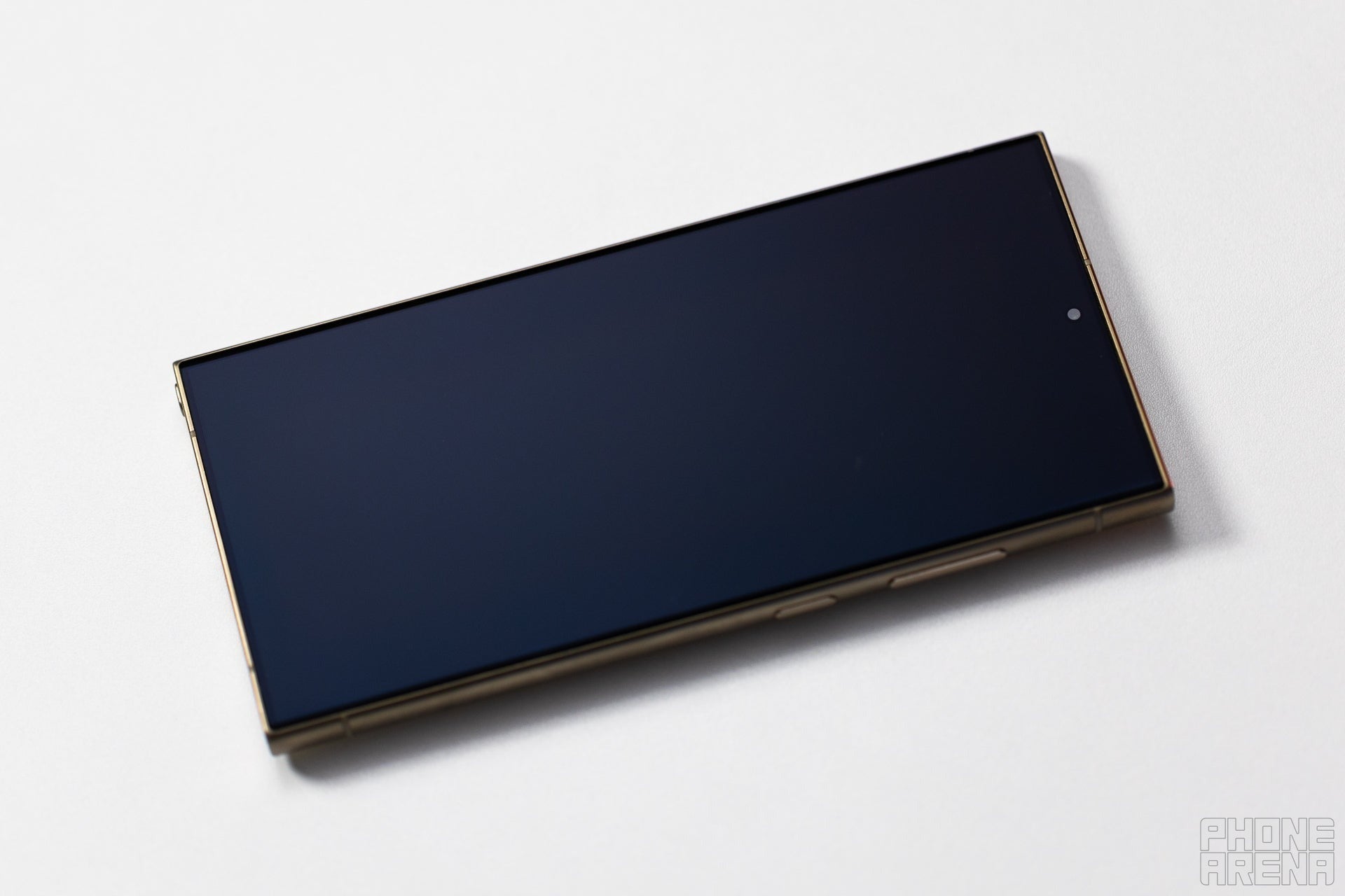 Galaxy S24 Ultra lying face down on a white surface