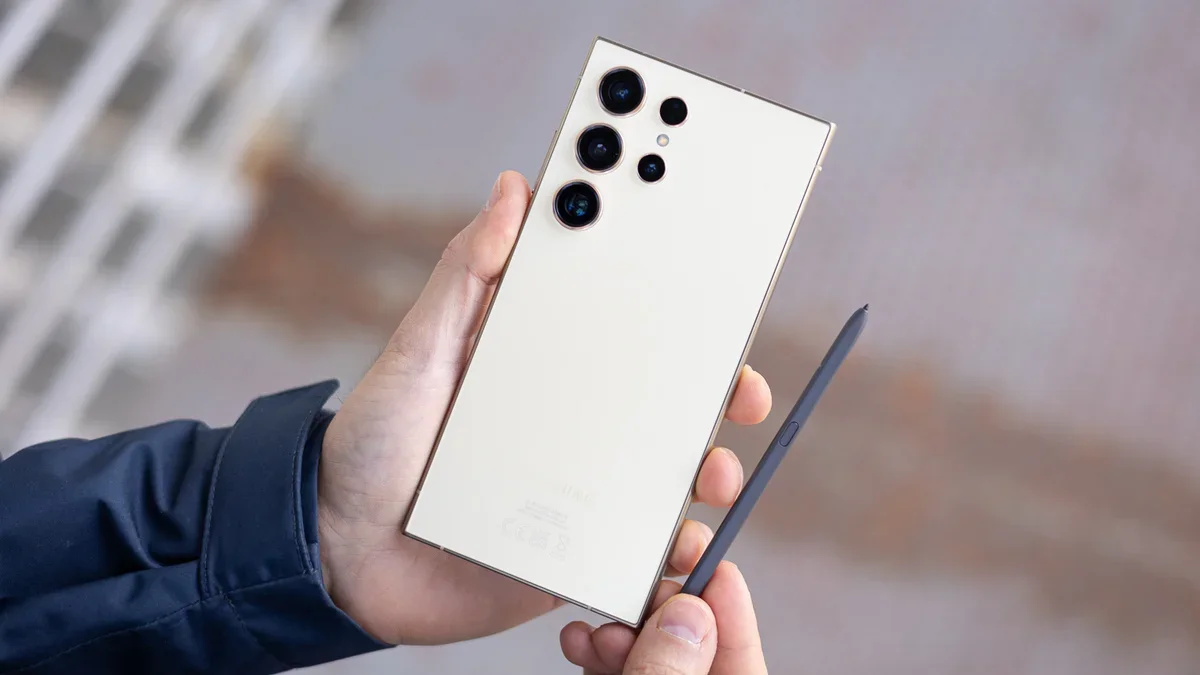 Samsung phone held in hand.