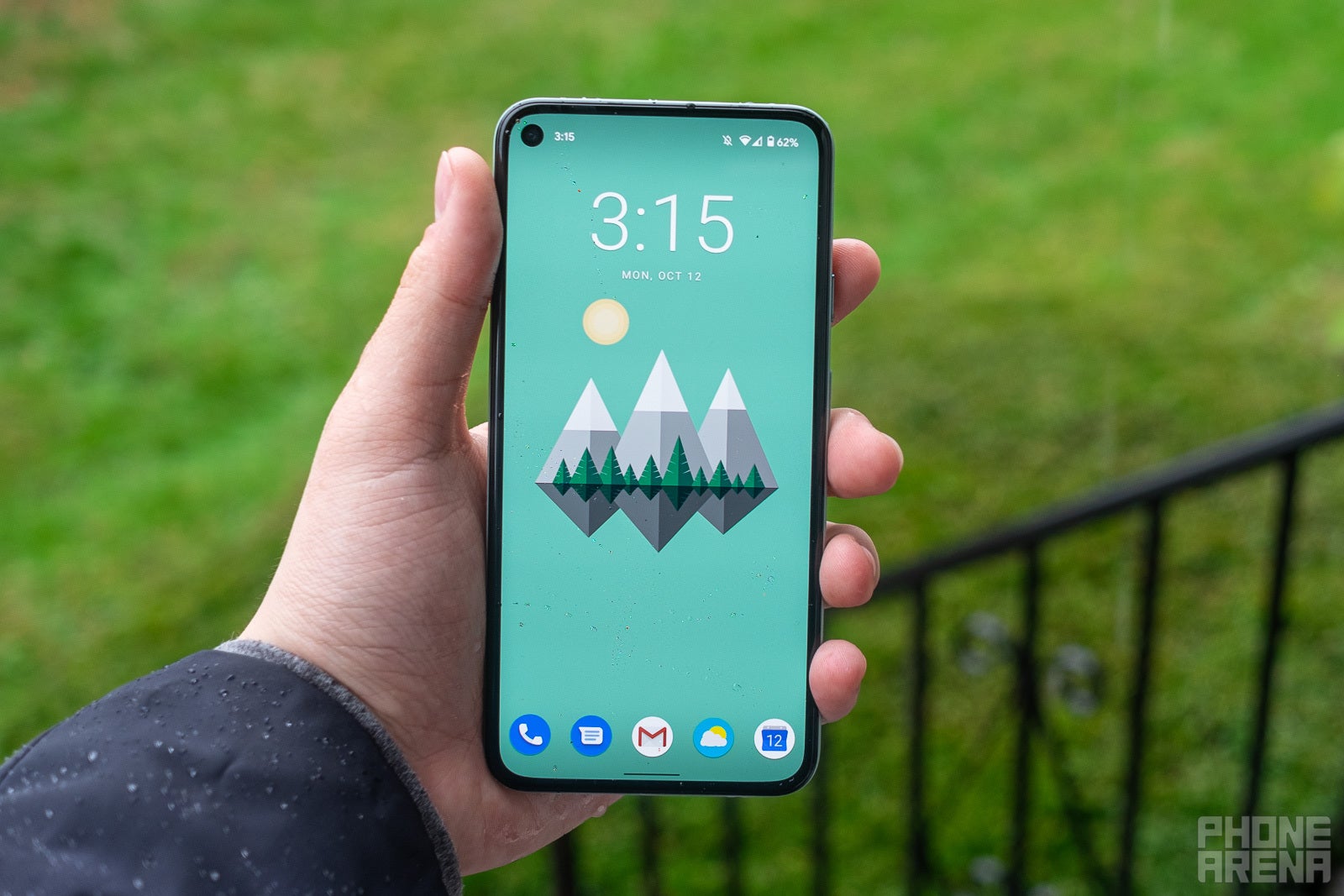 A man holding the Google Pixel 5.